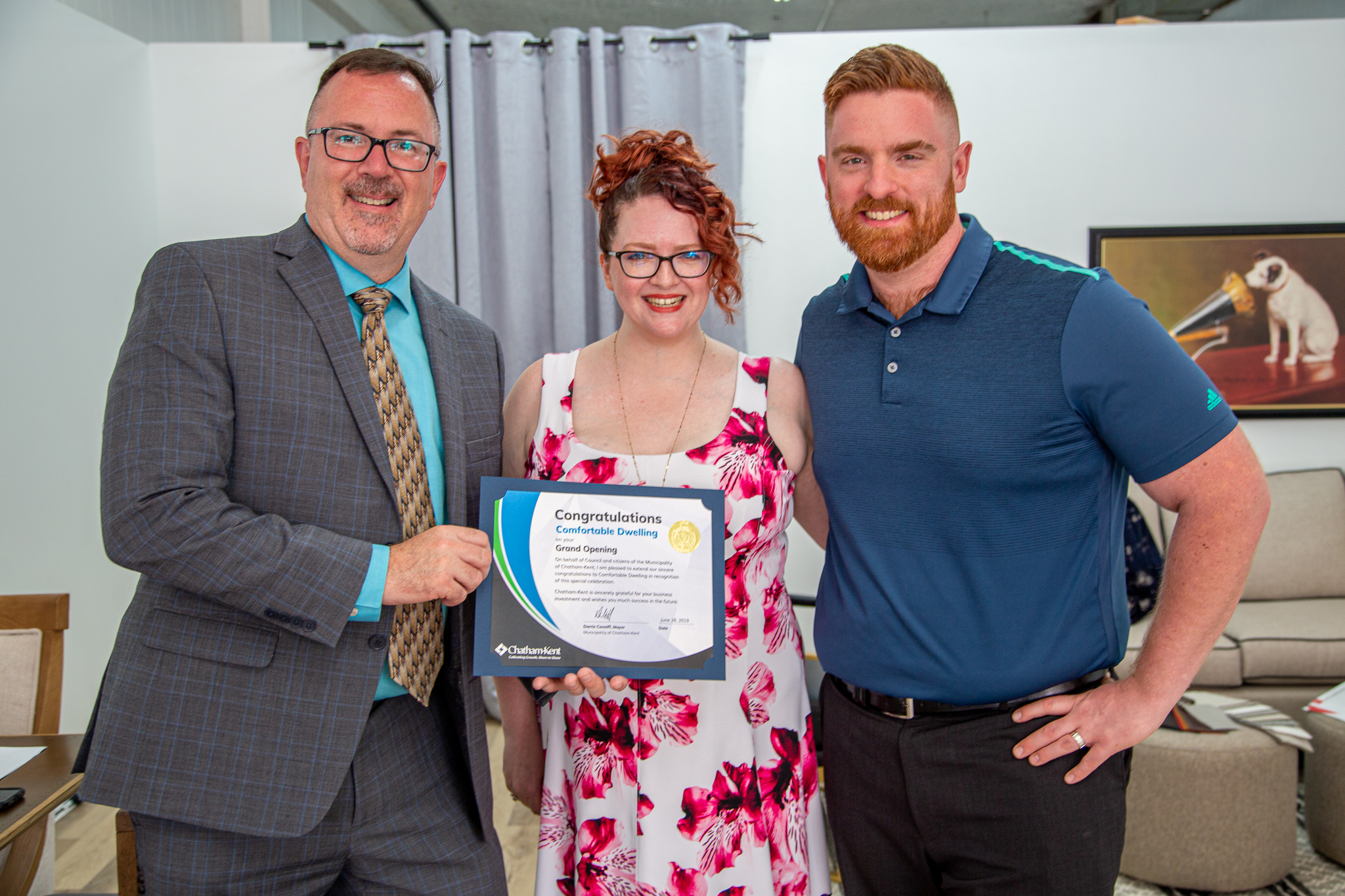 Mayor Darrin Canniff, along with owners of Comfortable Dwelling, Kyle and Heather Prestanski