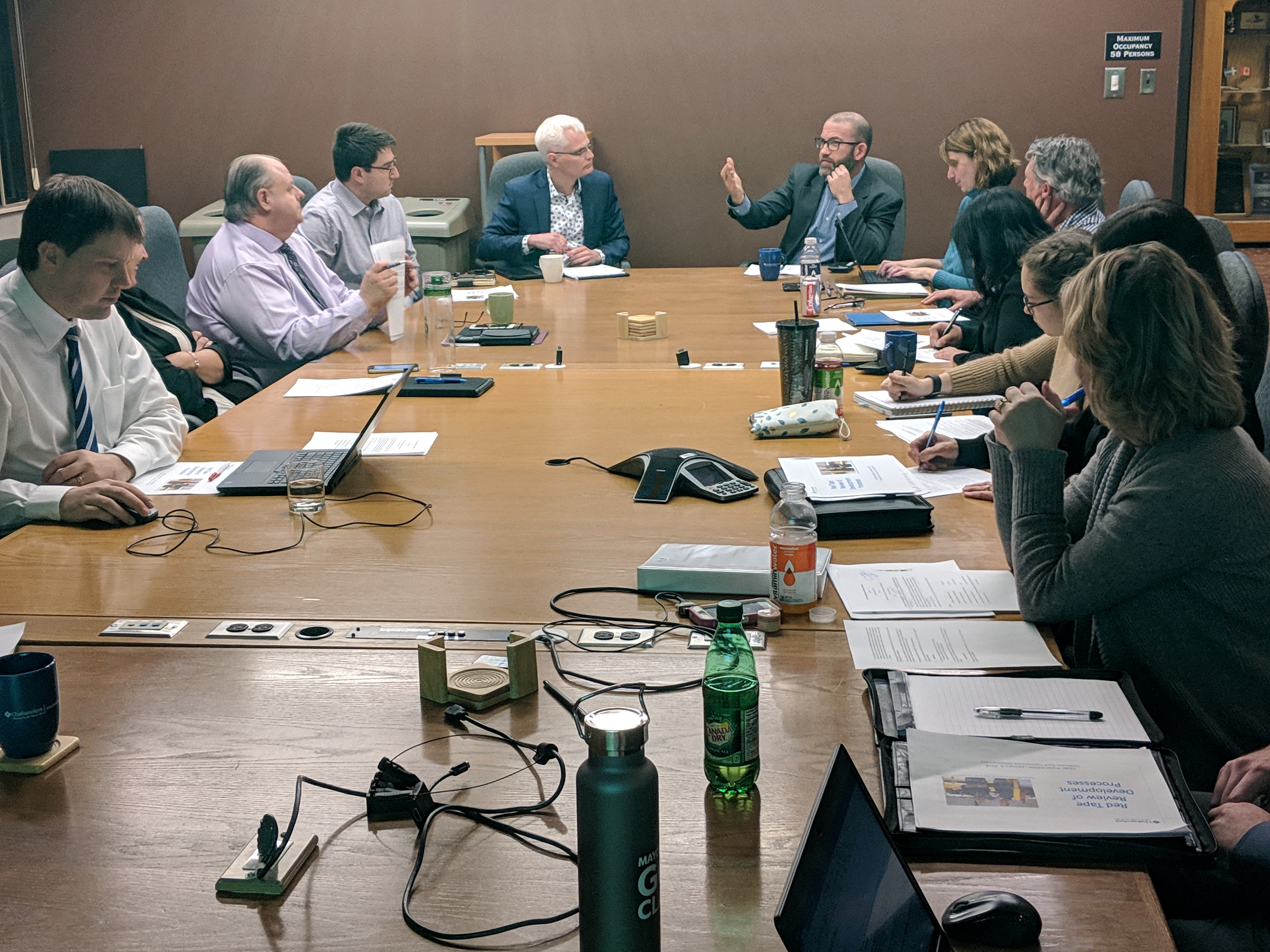 Aaron Hall assuming the role of Chair and leading the Community Development Advisory Committee meeting