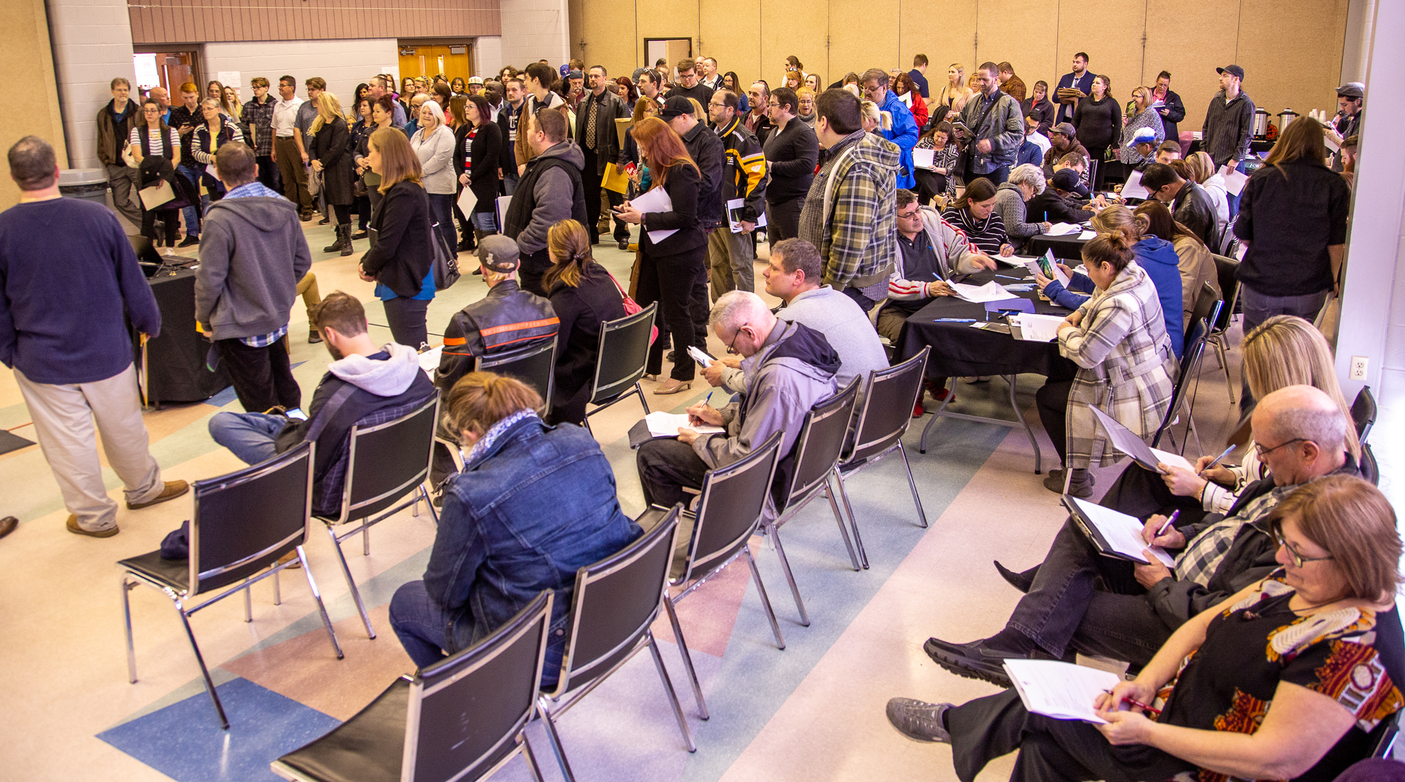 In a packed room at the Active Lifestyle Centre, applicants waited to attend on-the-spot interviews with officials from Curative