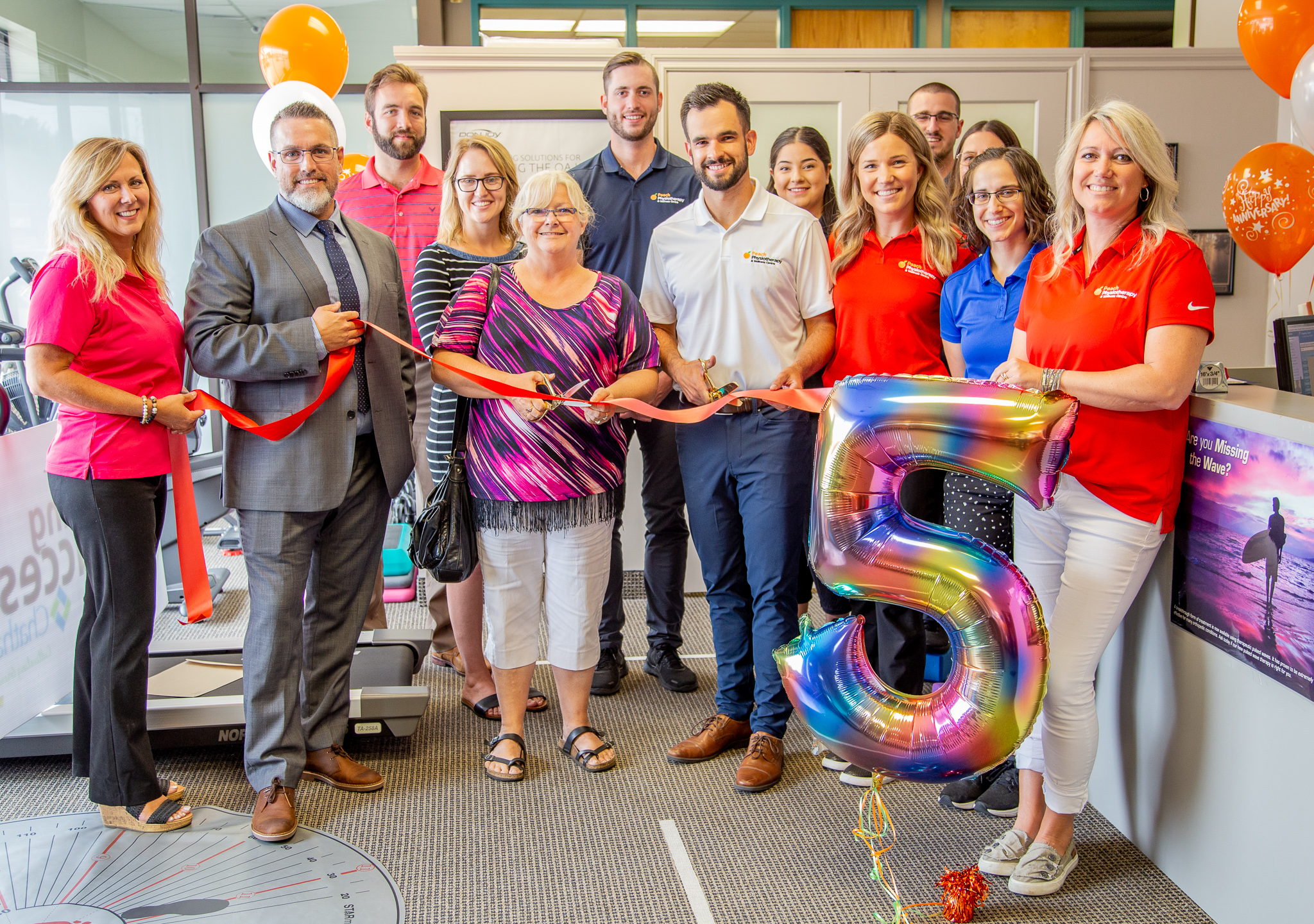 the Peach Physiotherapy team for a ribbon cutting celebrating their 5th year in business