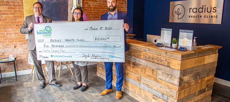 Radius Health Clinic is presented with a cheque for $5000 through the Small Business Centre Starter Company Plus program