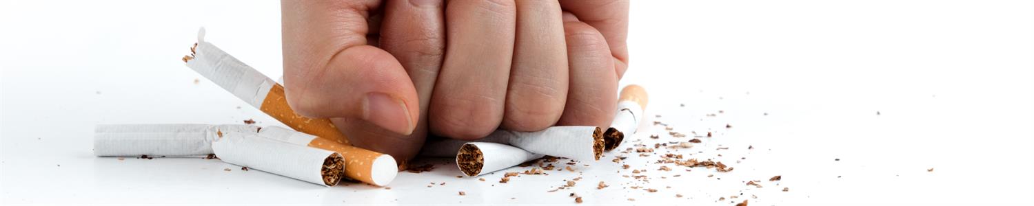 Image of hand smashing cigarettes.