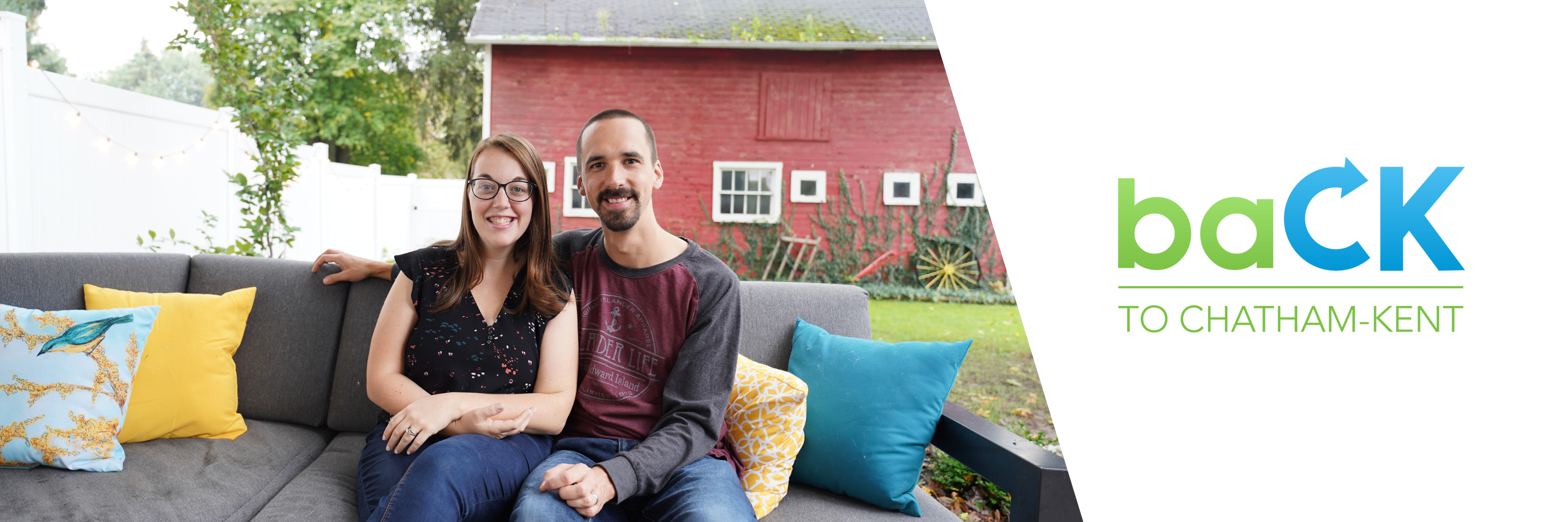 A couple sitting in their backyard. 