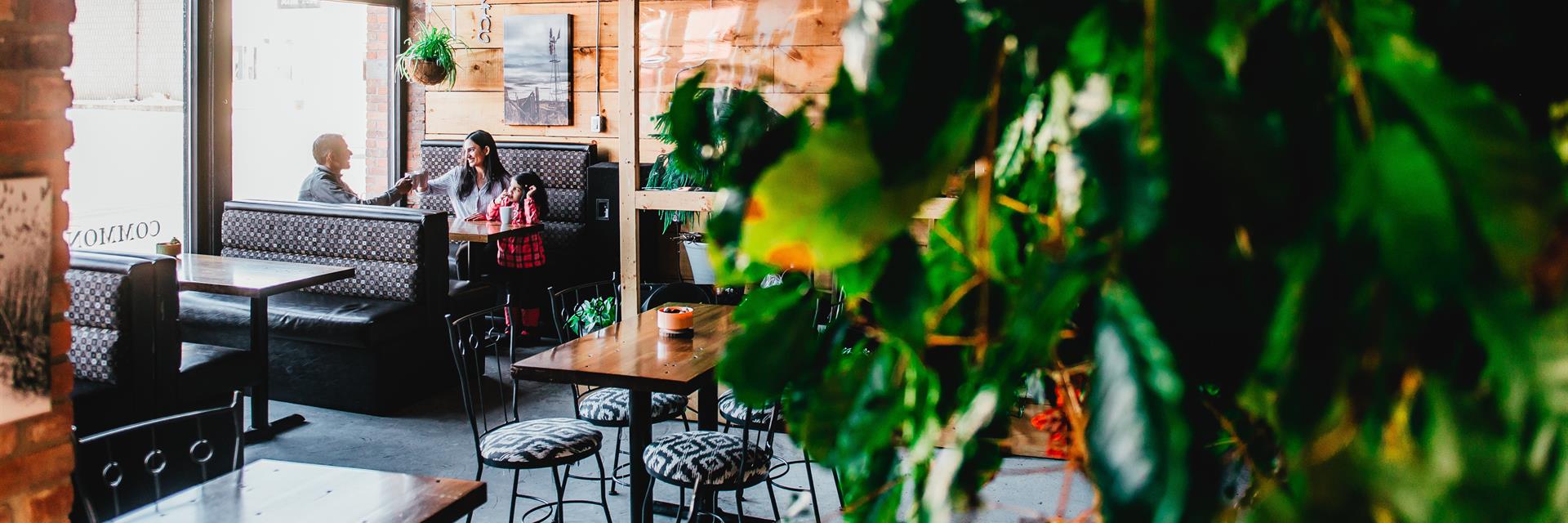 A couple talking in a cafe.