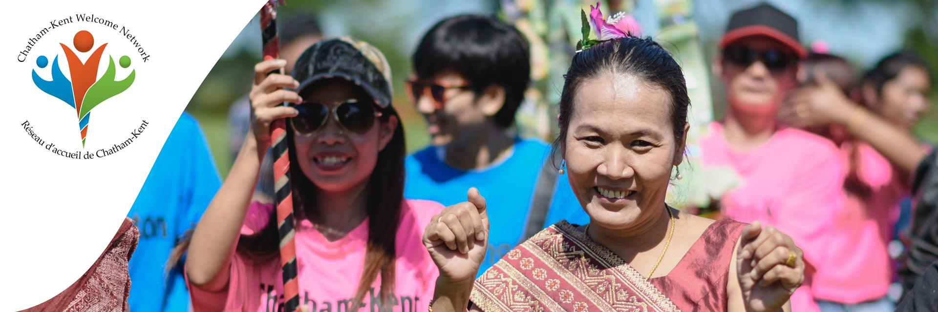 Group of people walk in traditional clothes