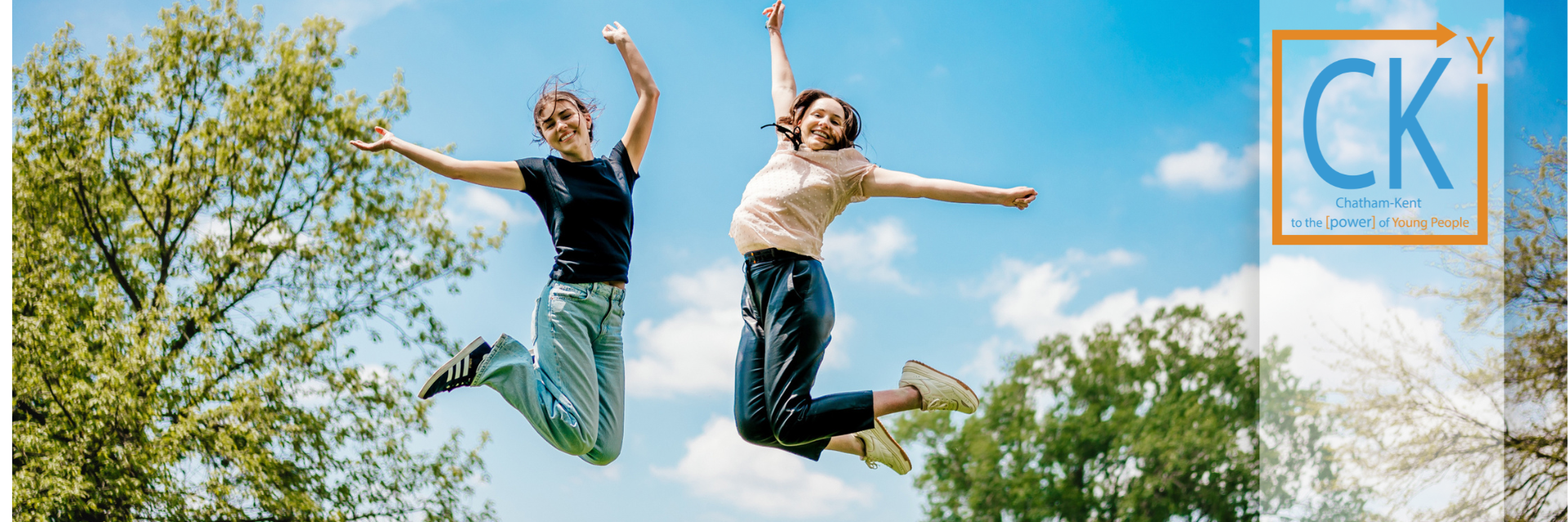 CKY Advisory Group members and Mayor Canniff smiling in a group with a bookshelf behind them.