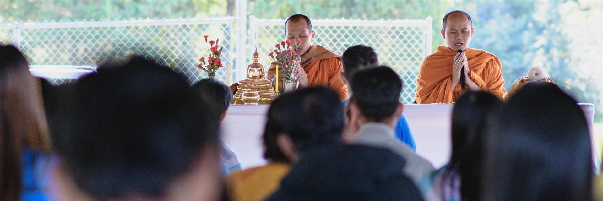 Buddhist ceremony in a park.