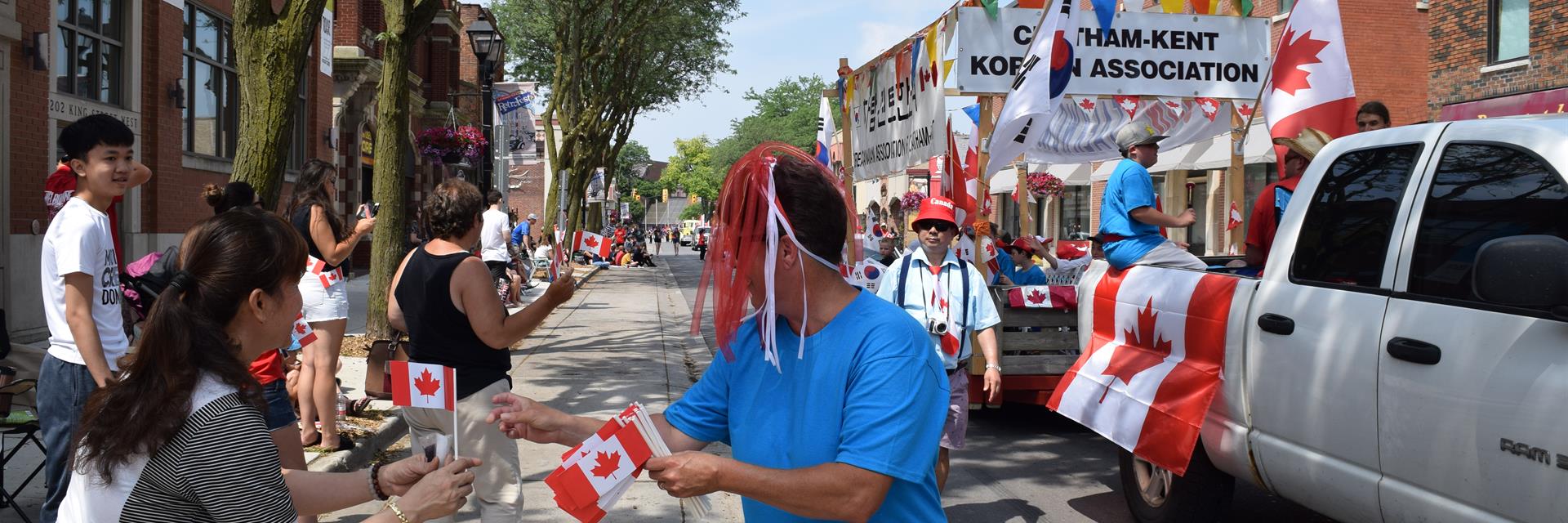 Parade with floats and people walking.