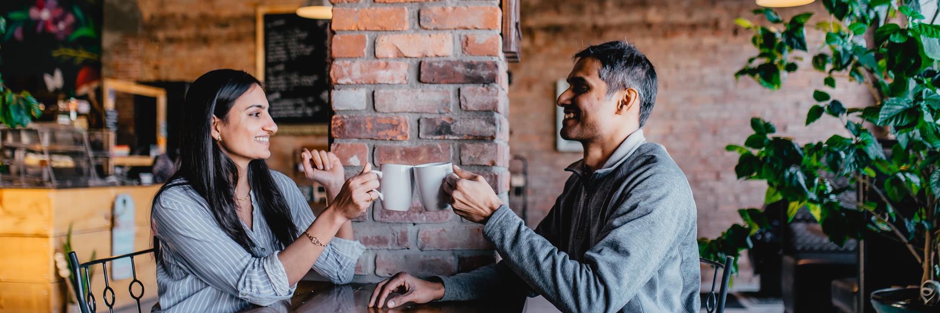 Two people having coffee in a cafe.