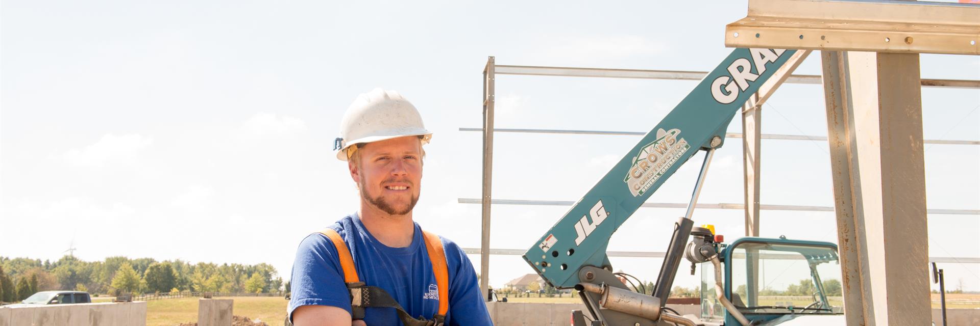 Construction worker standing in a job site.