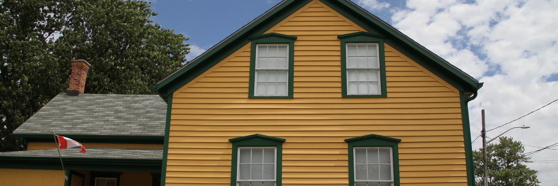 yellow and green house in downtown tilbury