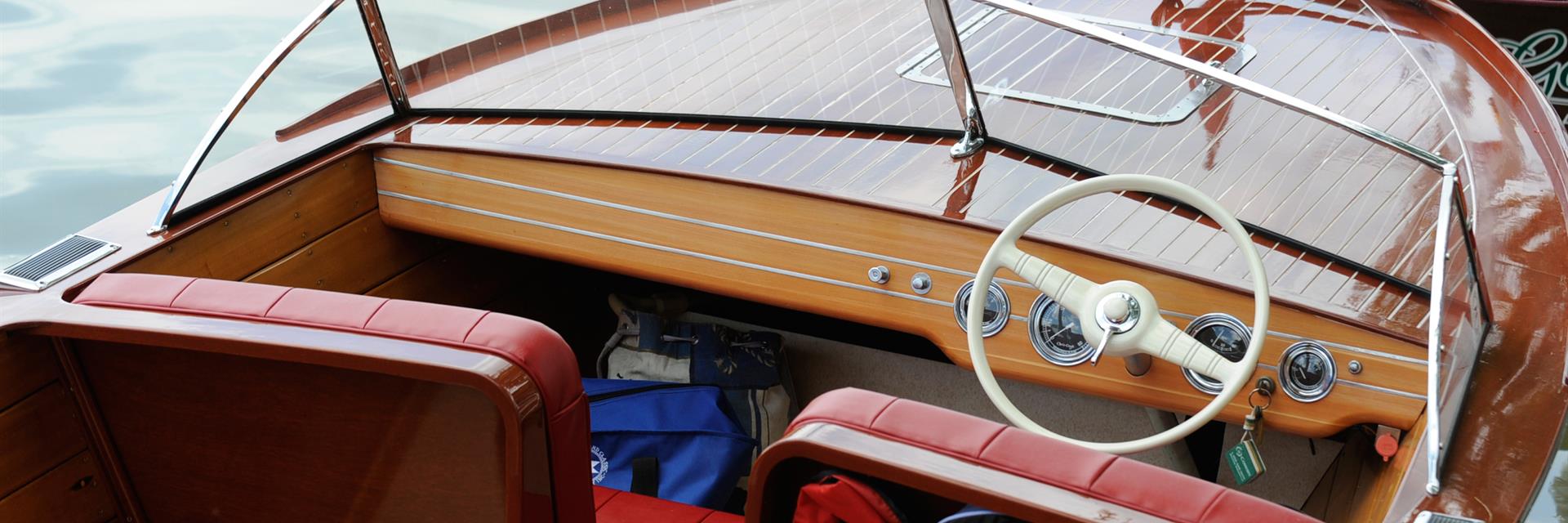 a classic wooden boat sits at the dock in wallaceburg during wambo