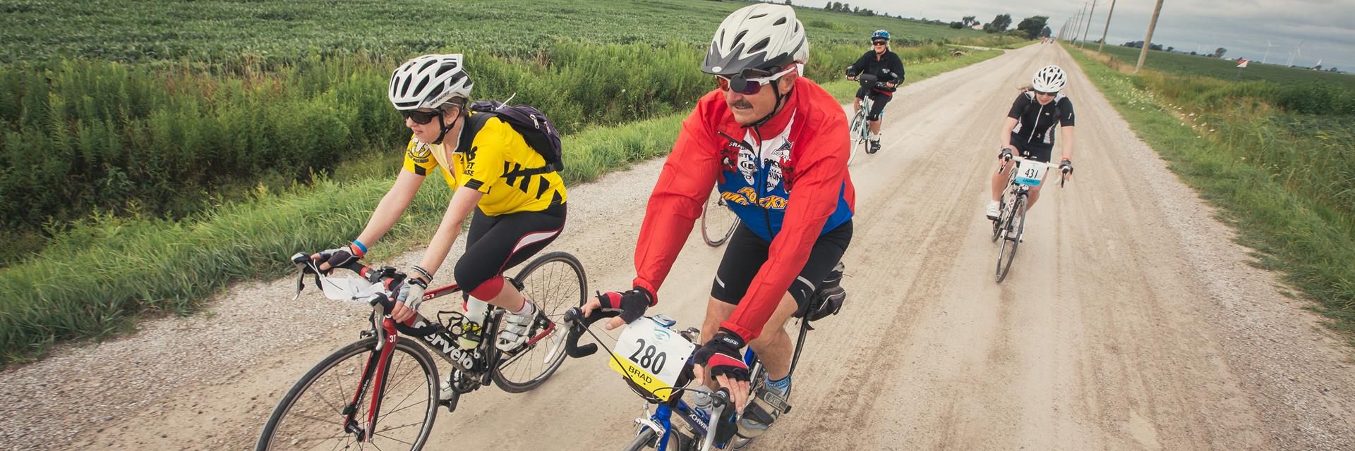 People biking down a trail