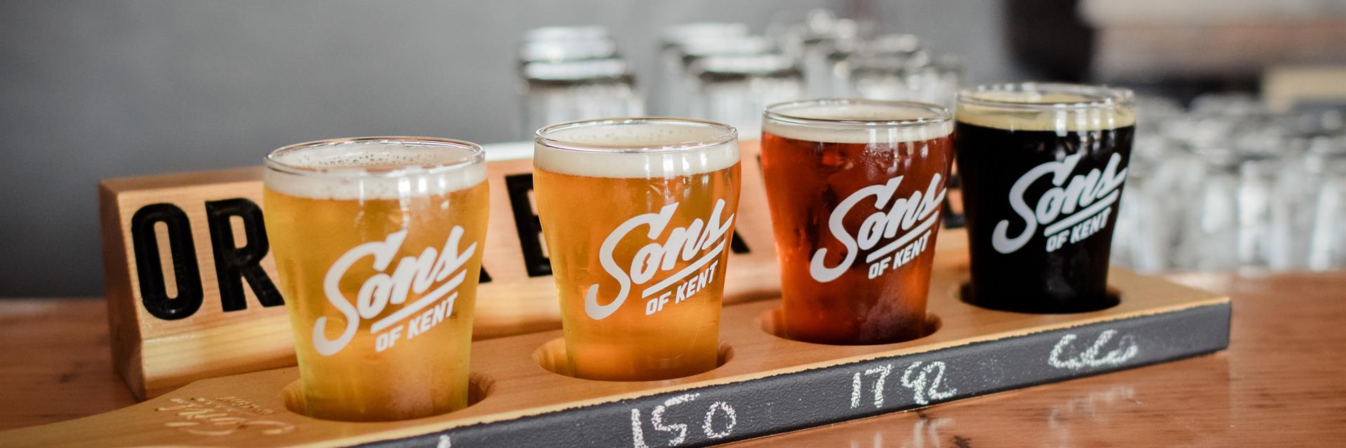 a flight of beer on a bar table 