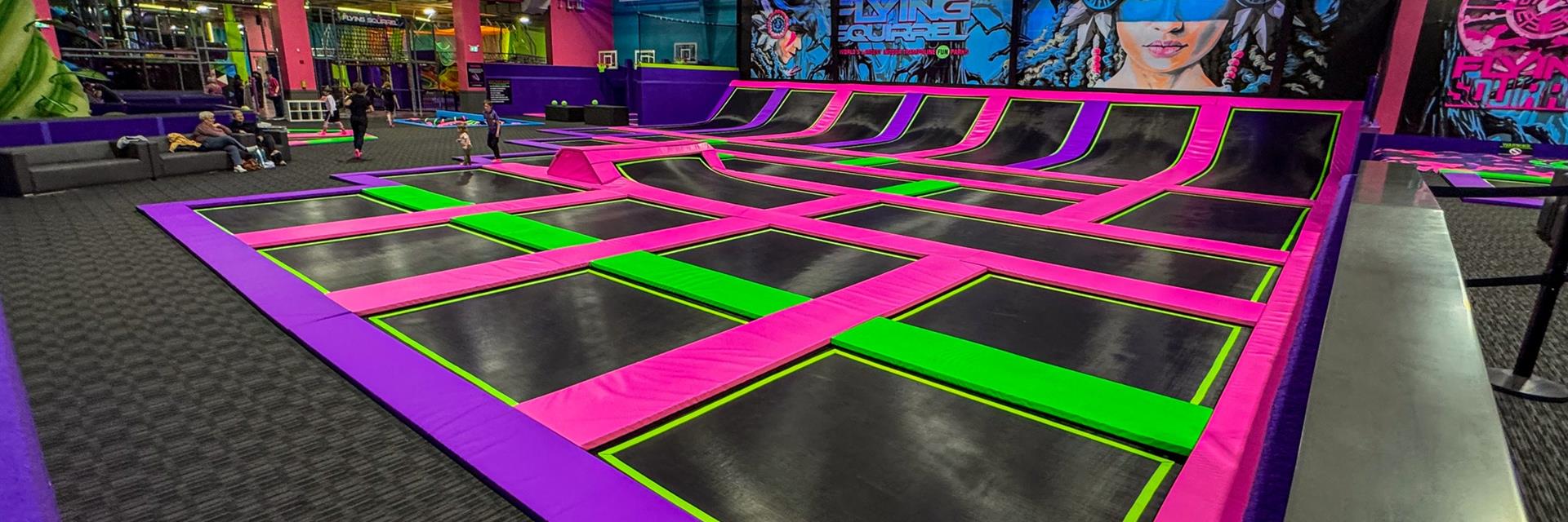 trampoline park with kids in the background indoors