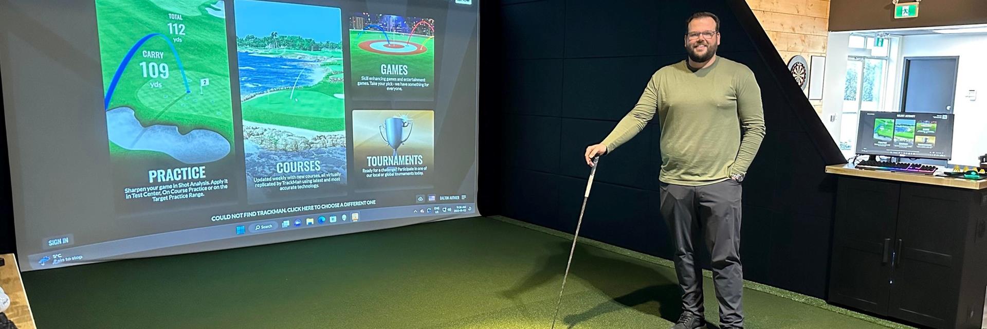 indoor golf screen with golfer