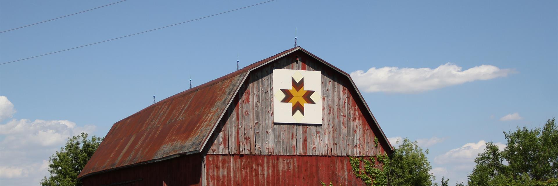 a barn quilt high atop a barn on the thames river barn quilt trail 